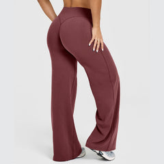 Woman wearing high-waisted straight leg yoga pants in a rich brown color, showcasing the soft, comfortable fit ideal for lounge or fitness activities.