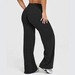 Woman wearing ultra-soft high-waisted straight leg yoga pants in black, standing with hand on hip, showcasing comfortable lounge and fitness wear.