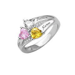 Silver personalized ring featuring three heart-shaped multicolor birthstones with custom engraved family names, designed as a meaningful gift for Mother's Day.