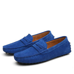 Pair of men's genuine suede penny loafers in vibrant blue with classic slip-on design and rubber sole, perfect for casual and formal occasions.