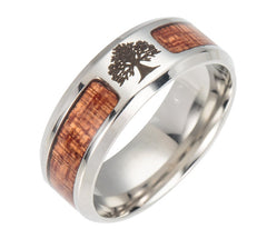 Men's ring featuring a polished stainless steel band with wood inlay and an etched tree of life design, ideal as an outdoor-inspired wedding band or gift.