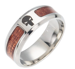 Stainless steel men's ring featuring wood inlays and a bold engraved skull design, combining rugged style with modern craftsmanship.