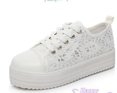 Close-up of the textured non-slip rubber sole and mesh-inspired detailing on white Xia Daddy shoes."