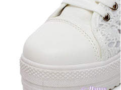 Close-up of the textured non-slip rubber sole and mesh-inspired detailing on white Xia Daddy shoes.