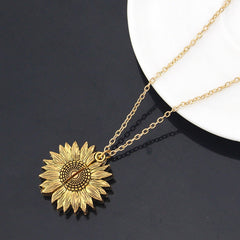 Gold sunflower locket necklace with detailed petals and a delicate chain, symbolizing a heartfelt and sentimental gift for women and men.
