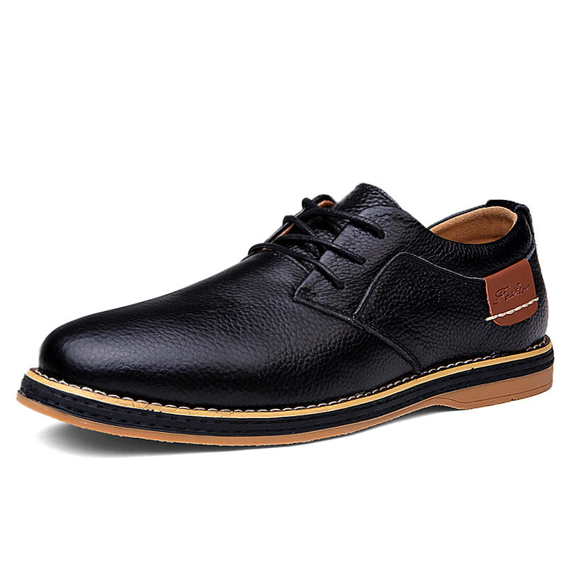 Black genuine leather men's lace-up Oxford shoe with tan sole and stitching, designed for comfortable business casual wear.