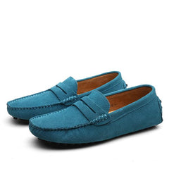 Pair of men's genuine suede penny loafers in blue with classic slip-on design, featuring detailed stitching and soft, comfortable lining for casual or formal wear.