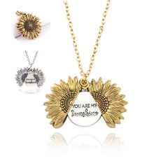 Gold sunflower locket necklace with a hidden message inside that reads "You are my sunshine," displayed with a delicate chain in gold and silver color options.