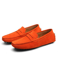 Pair of vibrant orange men's suede penny loafers with classic slip-on design, detailed stitching, and rubber sole studs ideal for casual and formal wear.