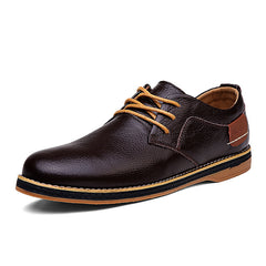 Dark brown men's genuine leather lace-up oxford shoe featuring tan laces and a contrasting tan and black sole, designed for comfortable business casual wear.