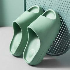 Lightweight green platform beach sandals made from eco-friendly EVA foam with a comfortable, cushioned sole designed for all-day wear.