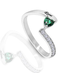 Silver personalized ring featuring a heart-shaped green birthstone and custom engraving, accented with small clear stones in a sleek modern design.