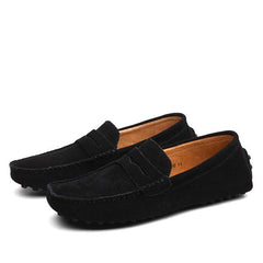 Pair of classic black men's suede penny loafers with slip-on design and a textured sole, suitable for casual and formal wear.