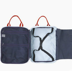 Water-resistant matte black travel backpack with multiple compartments and a dedicated laptop sleeve, styled for a professional business and travel look."