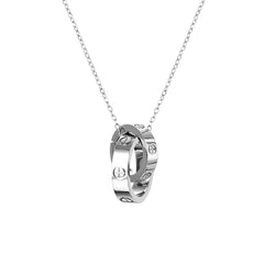 Close-up of a polished interlocking circle pendant on a delicate chain, featuring a sleek, hypoallergenic metal finish that highlights its modern and elegant design.