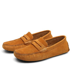 Pair of men's genuine suede penny loafers in brown featuring classic slip-on design and detailed stitching, ideal for casual and formal wear.