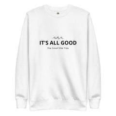 White heavyweight fleece crewneck sweatshirt with black text reading "IT'S ALL GOOD" and smaller text underneath saying "The Good Vibe Tide," featuring a minimal wave design above.
