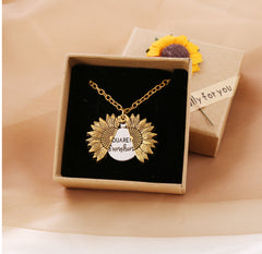 Gold sunflower locket necklace with a hidden "You are my sunshine" message inside, displayed in a gift box with a sunflower decoration and tag reading "only for you