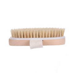 Natural bristle bath brush with wooden handle and fabric strap designed for exfoliating skin and enhancing shower routines.