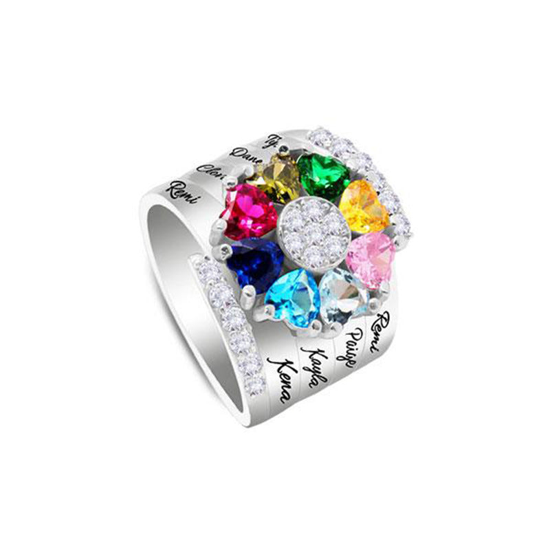 Silver multicolor custom engraved family birthstone ring with eight heart-shaped stones arranged in a circle, accented with small clear crystals and personalized names on the band, a meaningful gift for Mother's Day.