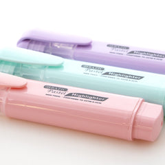Three pastel-colored highlighters in pink, mint green, and lavender with pocket clips, displayed on a white background.