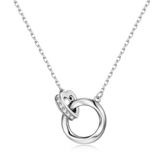Dainty sterling silver necklace featuring an interlocking circle and heart pendant accented with small sparkling stones, a thoughtful gift for Mother's Day.