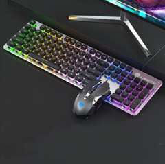 RGB backlit wired gaming keyboard with 104 keys paired with a sleek gaming mouse, set on a black desk beneath a curved monitor.
