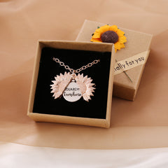 Rose gold sunflower locket necklace with a hidden message that reads "You are my sunshine," displayed in a gift box decorated with a small sunflower and a "Especially for you" tag.