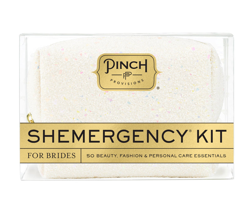 Clear bridal emergency kit with a sparkling textured pouch labeled for brides, containing 50 beauty, fashion, and personal care essentials for wedding day preparedness.
