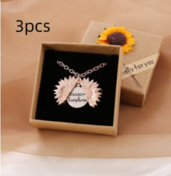 Rose gold sunflower locket necklace with a hidden message, displayed in a gift box adorned with a sunflower decoration and a small "especially for you" tag.