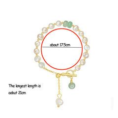 Adjustable bracelet featuring irregular white freshwater pearls and natural green jade beads with gold accents and a toggle clasp, elegantly displayed on a white background.