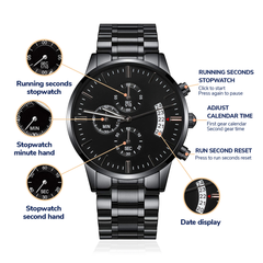 Black men's chronograph watch with metal link band featuring stopwatch functions, date display, and engraved design, styled as a unique groomsman gift.