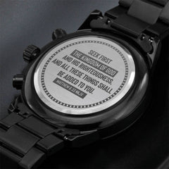 Close-up of the back of a black men's chronograph watch featuring an engraved scripture from Matthew 6:33 about seeking the kingdom of God, highlighting a faith-based gift.