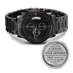 Men's black chronograph watch with engraved leadership scripture from Mark 10:43, featuring a sleek metal band and multiple timekeeping dials, a faith-based gift.
