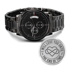 Black chronograph men's watch with metal link band, featuring a date display and engraved backplate with intertwined hearts and the phrase "I will love you until the end of time.