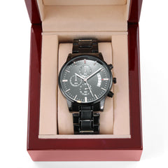 Men’s black chronograph watch with sleek metal band displayed in a polished wooden gift box, ideal as a faith-inspired gift with elegant and bold design.