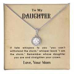 Silver necklace with a sparkling round pendant displayed on a card featuring an inspirational message from a mother to her daughter, encouraging strength and resilience.