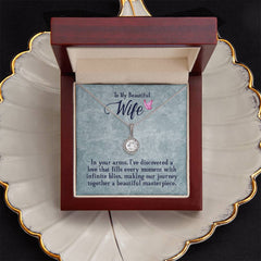 Elegant silver necklace with a sparkling cushion cut crystal pendant displayed in a wooden gift box with a heartfelt message for a wife, perfect for sentimental gifts.