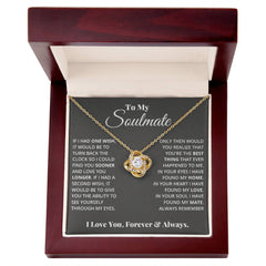 To My Soulmate Love Knot Necklace, gold-tone pendant with a crystal on a delicate chain in a burgundy jewelry box.