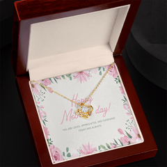 Heartfelt Mother's Day message card inside a jewelry gift box with a sparkling love knot pendant.