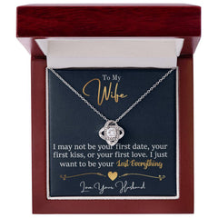 To My Last Everything Love Knot Necklace in silver with cubic stones, presented in a red jewelry box.
