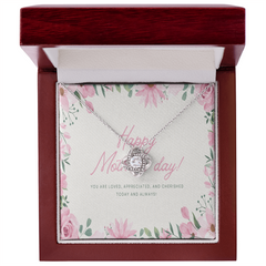 Silver love knot necklace with clear crystals displayed in a polished wooden gift box with a floral message card saying "Happy Mother’s Day" and sentimental text.
