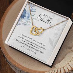 To My Sister Interlocking Hearts Necklace in gold-tone metal on chain in a gift box