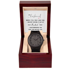 Elegant wooden wristwatch with a dark face and band displayed in a polished wooden gift box featuring a heartfelt message for a husband, perfect as a sentimental gift.