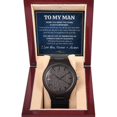Elegant dark wooden watch with a textured face, displayed in a beige cushioned interior inside a polished wooden gift box featuring a heartfelt message for a soulmate.