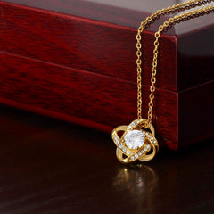 Love Knot Necklace, gold-tone jewelry featuring a central crystal and pave-accented intertwined loops