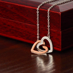 Interlocking Hearts Necklace by ShineOn Fulfillment; two-tone rose gold and silver pendant with crystal accents