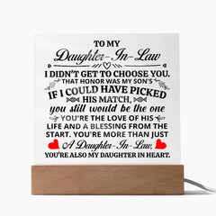Heartfelt acrylic plaque with LED light base, featuring a loving message to a daughter-in-law, displayed on a wooden stand perfect for sentimental home décor and gifts.