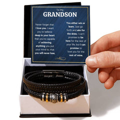Black braided men's leather bracelet with engraved magnetic clasp, presented in a gift box with a heartfelt message card for a grandson from grandparents.