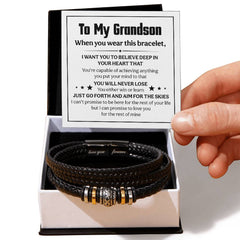 Black braided leather men's bracelet with engraved magnetic clasp, presented in a gift box alongside a heartfelt message card from a grandparent to their grandson.